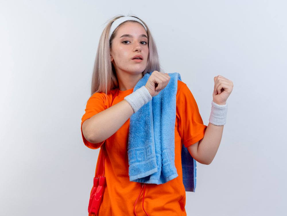 http://www.mizutowel.com/cdn/shop/articles/confident-young-caucasian-sporty-girl-with-braces-with-jumping-rope-around-neck-wearing-headband-wristbands-holding-towel-shoulder-points-back-with-two-hands-whitef-wall_1.jpg?v=1685518187